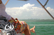 Woman reclining on sailboat in Miami