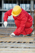 construction worker making reinforcement