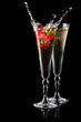 Two glasses of sparkling wine (champagne) with splash