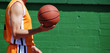 Holding a Basket ball