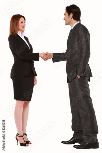 Photo: businessman and businesswoman shaking hands businessman and businesswoman shaking hands