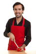 chef cutting tomatoe