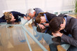 businessman and businesswoman exhausted during a meeting