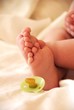 Babyfeet with pacifier