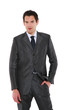 businessman standing with hand in pocket