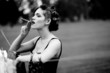 Photographie : Housewife smoking a cigar after hanging clothes to dry