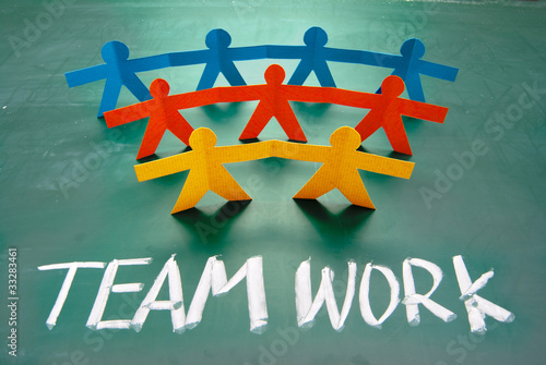 Photo: Teamwork words and colorful paper dolls Teamwork words and colorful paper dolls