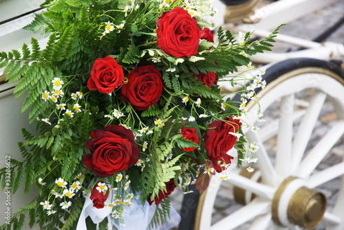 Photo: Wedding Carriage With Huge Bouquet On Side Wedding Carriage With Huge Bouquet On Side