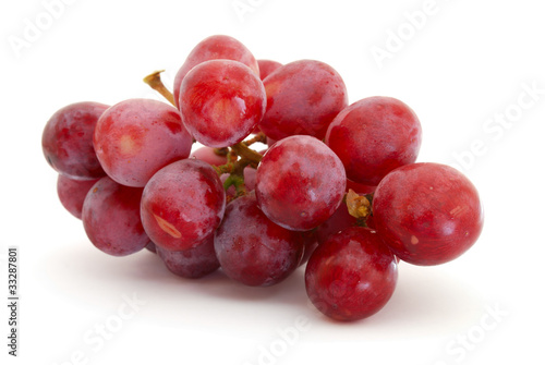 Photo: Red grapes isolated on white background Red grapes isolated on white background