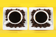 Two cups of espresso and coffee beans Two cups of espresso and coffee beans