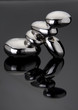 Stack of shining Zen pebbles on black
