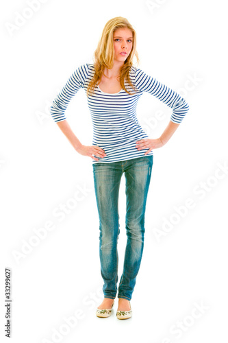 Photo: Beautiful teengirl with hands on hips attentively looking at you Beautiful teengirl with hands on hips attentively looking at you