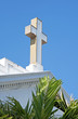 Cross on the roof top of an old white church in Sarasota, FL.