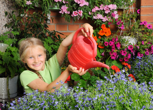 Photo: Girl pouring flowers Girl pouring flowers