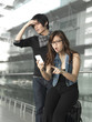 Asian Chinese couple dismayed over their flight schedule Asian Chinese couple dismayed over their flight schedule
