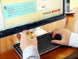 Businessman with credit card using computer