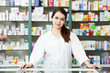 Pharmacy chemist woman in drugstore
