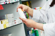 closeup hand of chemist with drug