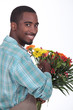 Male florist with a bunch of flowers