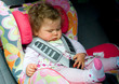 sleeping baby in a child car seat