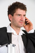 Foto: businessman with phone and dispatchcase businessman with phone and dispatchcase