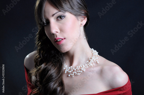 Photo: Girl in red dress with pearl necklace Girl in red dress with pearl necklace