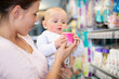 Photo: Mother with Baby in Supermarket Mother with Baby in Supermarket