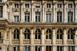 Front of an old Paris building with many windows Front of an old Paris building with many windows
