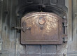 Closed iron stove in boiler room