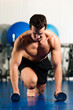 man doing pushups in gym