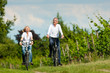 Happy couple cycling outdoors in summer