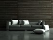 graues Sofa vor Holzwand graues Sofa vor Holzwand