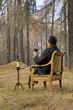 man sitting on the chair drinking wine