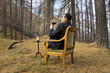 man sitting on the chair drinking wine