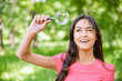 Woman looks through magnifier