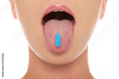 Photo: Pill on his tongue hanging out woman Pill on his tongue hanging out woman