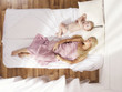 Beautiful young mom with naked baby