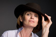 Smiling attractive mature woman in stetson