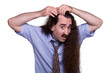 Hair Loss - balding man inspecting his receding hair line