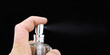 close-up of perfume spraying