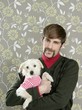 Photo: geek retro man holding dog silly on wallpaper geek retro man holding dog silly on wallpaper