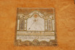 Medieval sun-dial painted on building wall in Briancon France