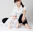 Photo: Mother and daughter sits on the floor Mother and daughter sits on the floor