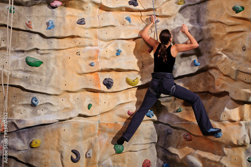 Photo: woman on rock wall woman on rock wall