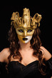 woman in golden party mask