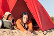 Camping happy woman relax tent on beach