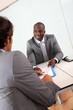 Businessman having client signing contract