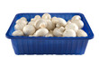 Fresh champignion mushrooms in blue box