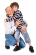 Foto: Grandson hugging his grandpa, indoors Grandson hugging his grandpa, indoors