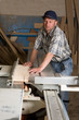 Carpenter working on woodworking machines